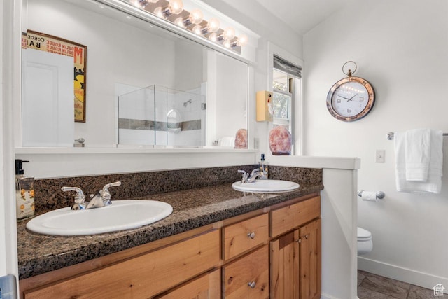 2193 E Robie Hill Ln, Millcreek, UT 84109 - full bath featuring toilet, a shower stall, double vanity, and baseboards