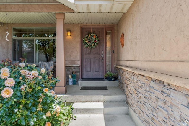 2193 E Robie Hill Ln, Millcreek, UT 84109 - entrance to property featuring stone siding, stucco siding, and covered porch