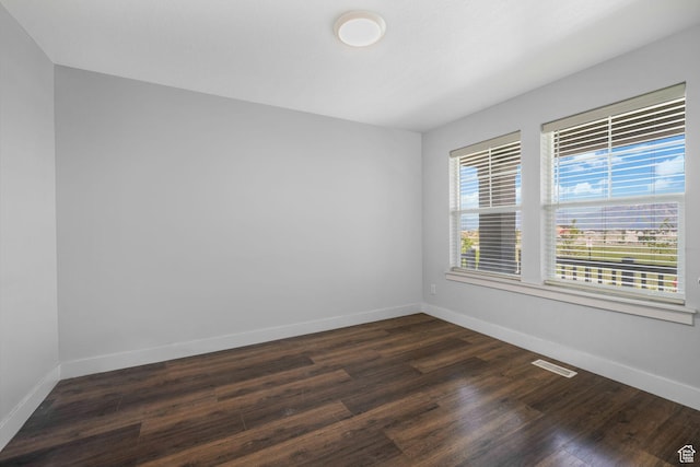 12364 S Boggs Way, Herriman, UT 84096 - unfurnished room with baseboards and dark wood-style flooring
