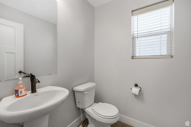 12364 S Boggs Way, Herriman, UT 84096 - bathroom with baseboards, a sink, and toilet
