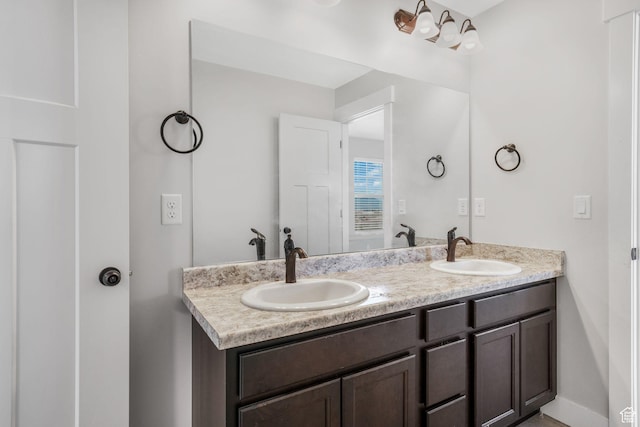 12364 S Boggs Way, Herriman, UT 84096 - full bathroom featuring double vanity and baseboards