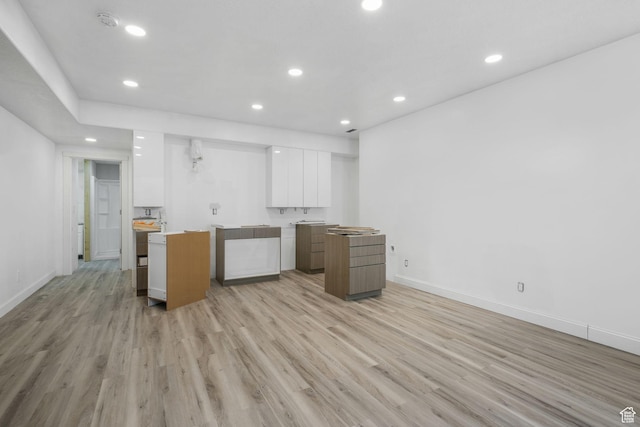 12364 S Boggs Way, Herriman, UT 84096 - kitchen featuring modern cabinets, white cabinets, recessed lighting, light wood finished floors, and baseboards