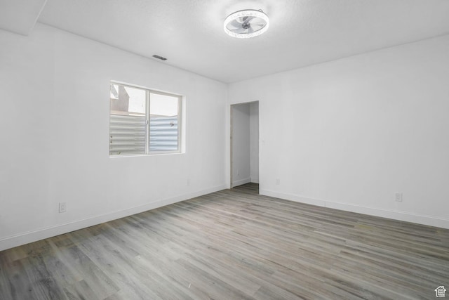 12364 S Boggs Way, Herriman, UT 84096 - unfurnished room with wood finished floors and baseboards