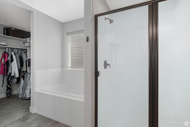 12364 S Boggs Way, Herriman, UT 84096 - bathroom featuring a shower stall, a bath, and a walk in closet
