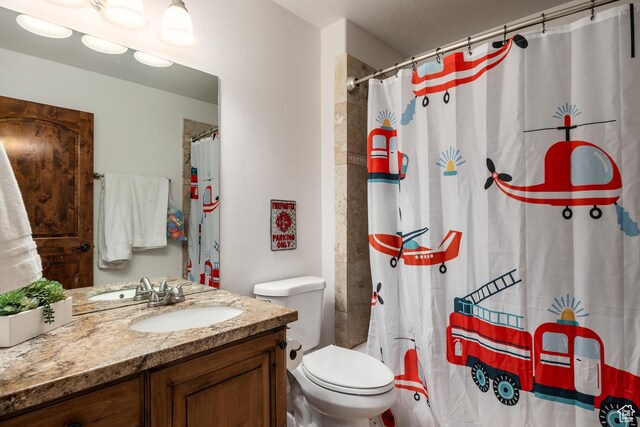 1877 E 3990 S, Holladay, UT 84124 - bathroom with vanity, toilet, and a shower with curtain
