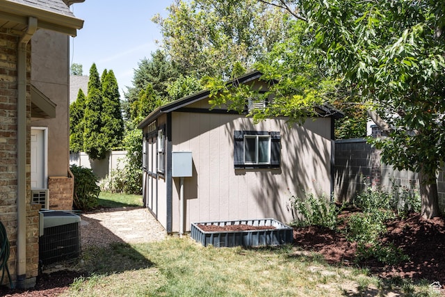 1877 E 3990 S, Holladay, UT 84124 - view of property exterior featuring central AC and a shingled roof