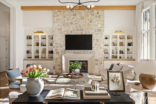478 S Maple Lakes Dr, Mapleton, UT 84664 - living room with a stone fireplace, a chandelier, and wood finished floors