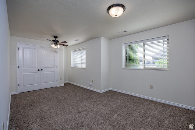 4962 S 5050 W, Hooper, UT 84315 - unfurnished bedroom with carpet floors, multiple windows, baseboards, and a closet