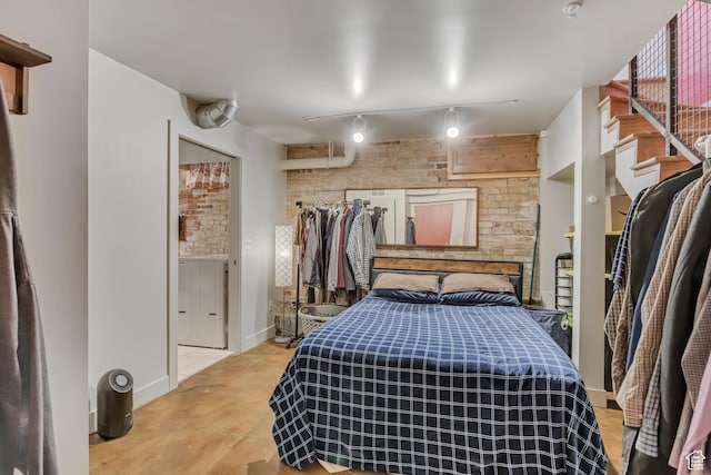 342 W 200 S Unit 107, Salt Lake City, UT 84101 - bedroom with track lighting, baseboards, and concrete flooring