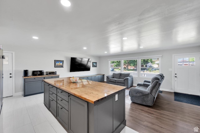 1701 N Forbes Ave W, Layton, UT 84041 - kitchen with butcher block countertops, gray cabinetry, open floor plan, healthy amount of natural light, and recessed lighting