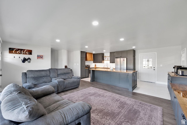 1701 N Forbes Ave W, Layton, UT 84041 - living room featuring recessed lighting, light wood-type flooring, and baseboards