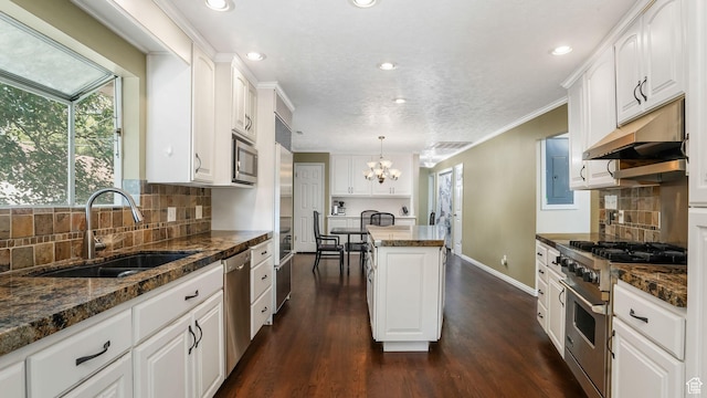 7505 S Creek Rd E, Cottonwood Heights, UT 84093 - kitchen with appliances with stainless steel finishes, a sink, a center island, a chandelier, and white cabinets