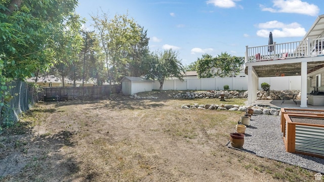 7505 S Creek Rd E, Cottonwood Heights, UT 84093 - fenced backyard featuring a patio area and a wooden deck