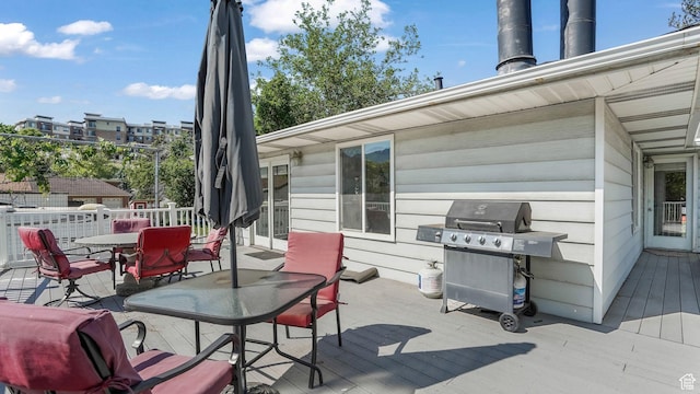 7505 S Creek Rd E, Cottonwood Heights, UT 84093 - wooden terrace featuring a grill and outdoor dining area