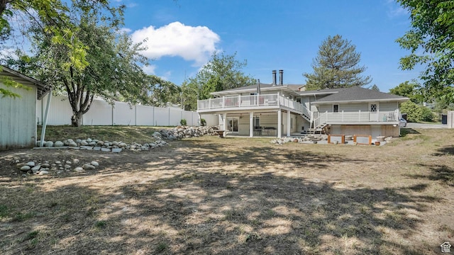 7505 S Creek Rd E, Cottonwood Heights, UT 84093 - back of property with a wooden deck and stairway