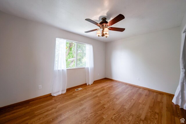 4213 S 2850 W, Roy, UT 84067 - spare room featuring light wood finished floors, baseboards, and a ceiling fan