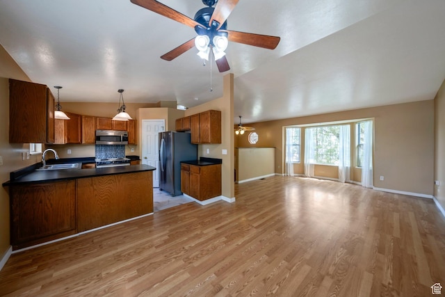4213 S 2850 W, Roy, UT 84067 - kitchen featuring stainless steel appliances, open floor plan, dark countertops, ceiling fan, and lofted ceiling