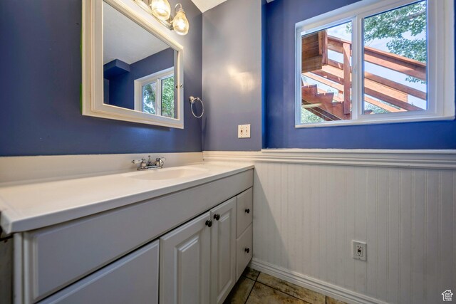 4213 S 2850 W, Roy, UT 84067 - bathroom with a wainscoted wall, vanity, and tile patterned floors