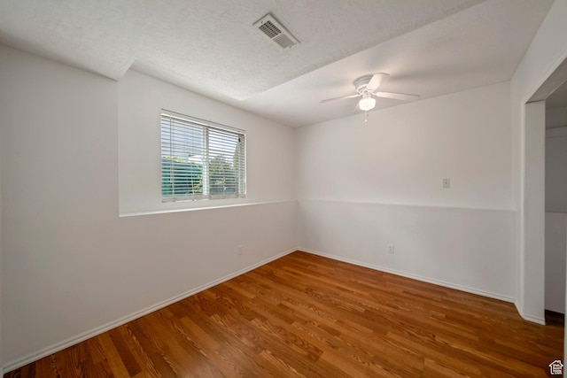 4213 S 2850 W, Roy, UT 84067 - empty room featuring wood finished floors, a ceiling fan, baseboards, and a textured ceiling
