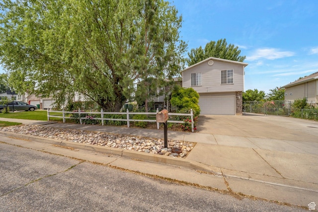 4213 S 2850 W, Roy, UT 84067 - view of front facade with a garage, driveway, and brick siding