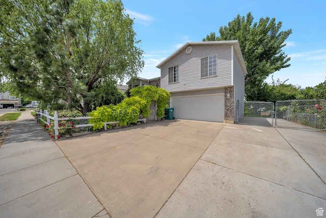 4213 S 2850 W, Roy, UT 84067 - view of side of home featuring driveway, an attached garage, and brick siding