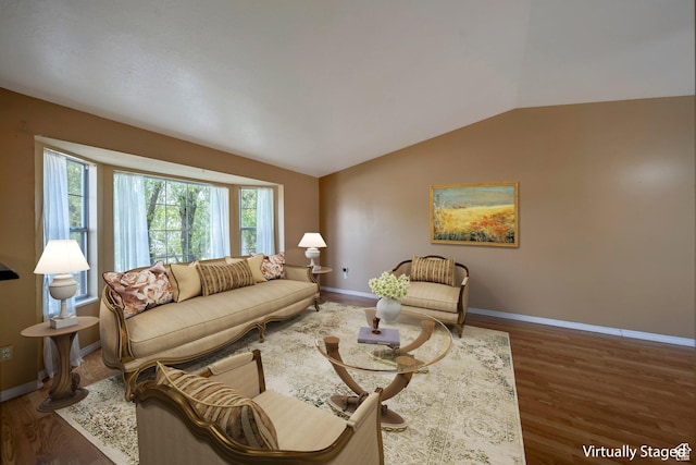 4213 S 2850 W, Roy, UT 84067 - living area featuring vaulted ceiling, wood finished floors, and baseboards