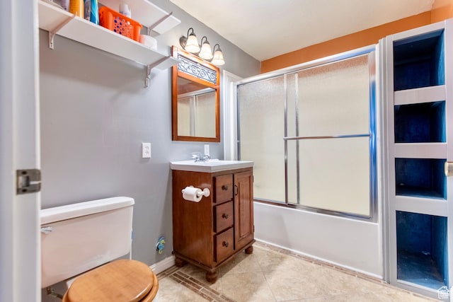 1092 S 470 E, Providence, UT 84332 - bathroom with vanity, combined bath / shower with glass door, toilet, baseboards, and tile patterned floors