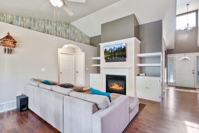 1092 S 470 E, Providence, UT 84332 - living room with high vaulted ceiling, dark wood-style floors, ceiling fan, a glass covered fireplace, and arched walkways