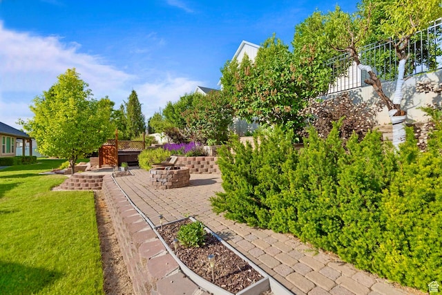 1092 S 470 E, Providence, UT 84332 - view of grassy yard with a patio and a fire pit