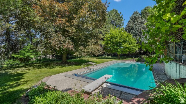 412 S 100 E, Salem, UT 84653 - swimming pool featuring a lawn, a diving board, and view of wooded area