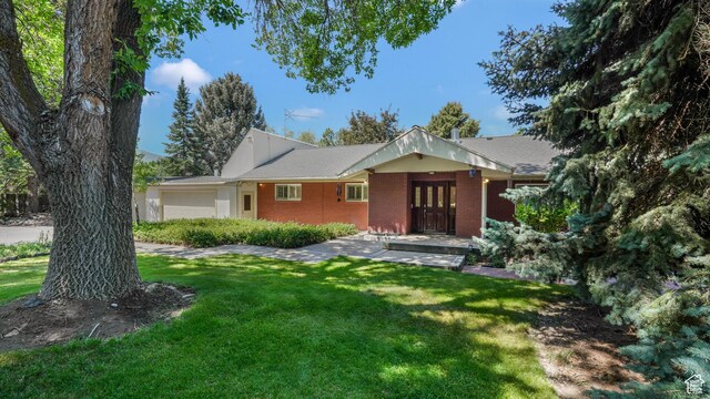 412 S 100 E, Salem, UT 84653 - ranch-style home with an attached garage, brick siding, a front lawn, and french doors