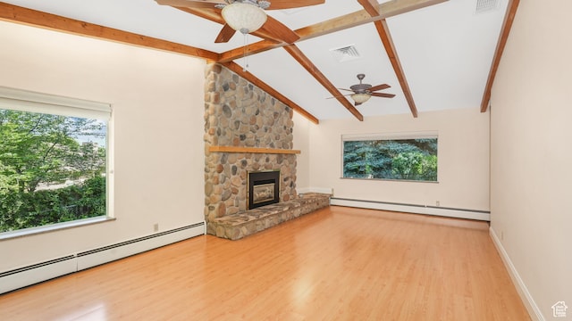 412 S 100 E, Salem, UT 84653 - unfurnished living room with a ceiling fan, baseboard heating, and plenty of natural light