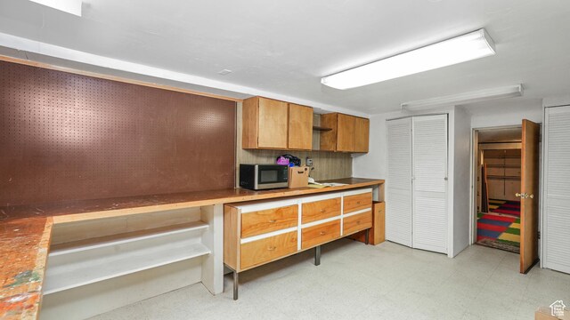412 S 100 E, Salem, UT 84653 - kitchen featuring stainless steel microwave, light floors, brown cabinetry, and open shelves