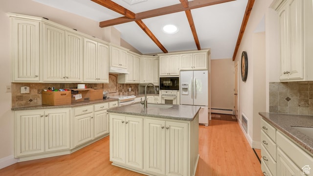 412 S 100 E, Salem, UT 84653 - kitchen with white appliances, a sink, cream cabinetry, and decorative backsplash
