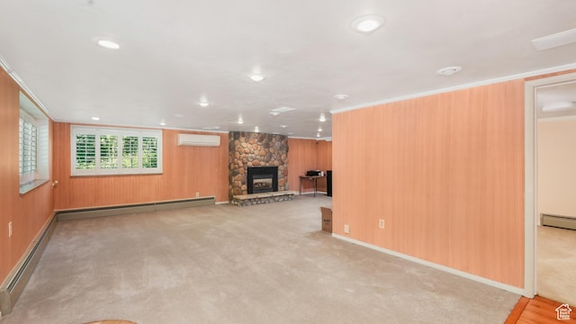 412 S 100 E, Salem, UT 84653 - unfurnished living room with a wall mounted AC, a baseboard heating unit, a stone fireplace, wooden walls, and carpet flooring