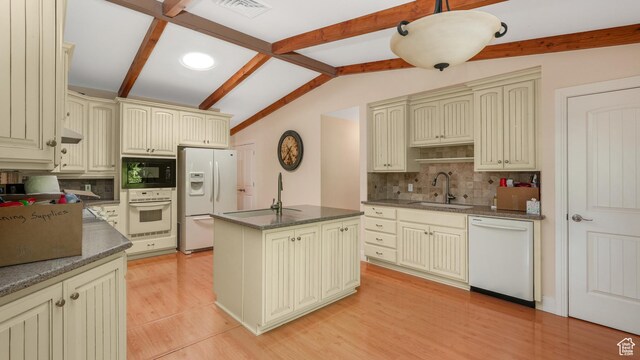 412 S 100 E, Salem, UT 84653 - kitchen featuring cream cabinets, white appliances, and dark countertops