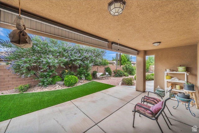 4034 Fortune Way, Washington, UT 84780 - fenced backyard with a patio area