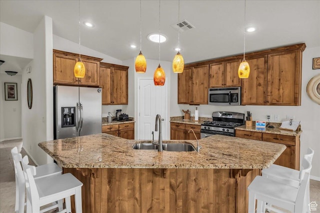 4034 Fortune Way, Washington, UT 84780 - kitchen with stainless steel appliances, a sink, brown cabinetry, a breakfast bar area, and vaulted ceiling