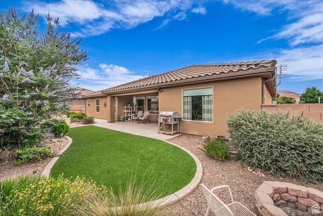 4034 Fortune Way, Washington, UT 84780 - rear view of house featuring stucco siding, a tiled roof, and a patio area