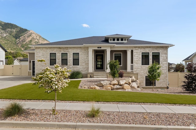 915 E 2100 N, North Ogden, UT 84414 - prairie-style home with a gate, a mountain view, and stone siding