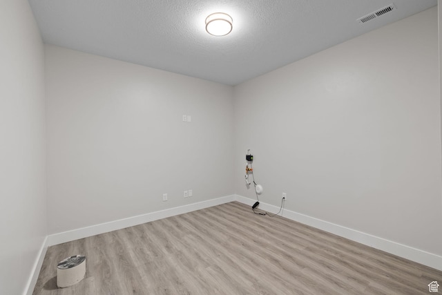 915 E 2100 N, North Ogden, UT 84414 - spare room with wood finished floors, baseboards, and a textured ceiling