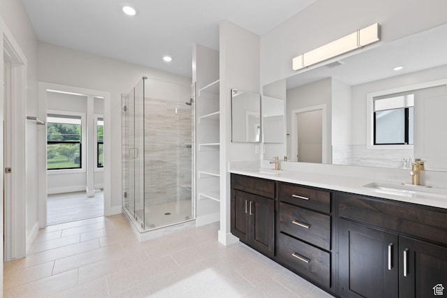 915 E 2100 N, North Ogden, UT 84414 - bathroom featuring double vanity, a shower stall, baseboards, recessed lighting, and tile patterned flooring