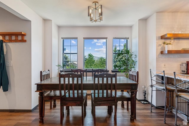 6530 Snow View Dr, Park City, UT 84098 - dining area featuring dark wood-style flooring, a chandelier, and baseboards