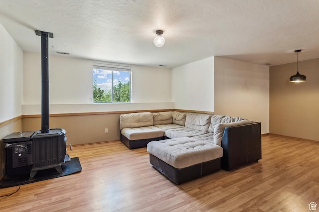 6530 Snow View Dr, Park City, UT 84098 - living area with a wood stove and wood finished floors