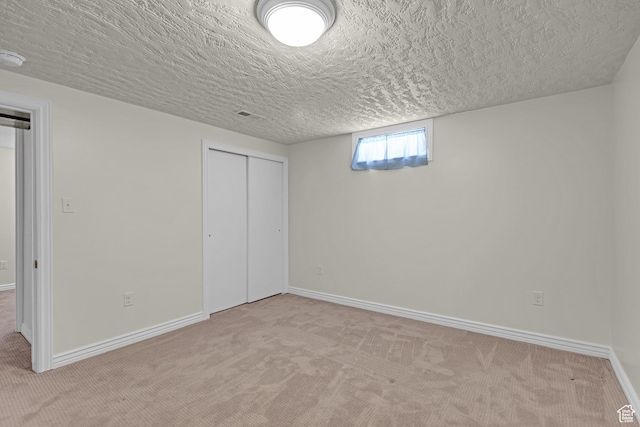2458 N 575 E, North Ogden, UT 84414 - below grade area with carpet, a textured ceiling, and baseboards