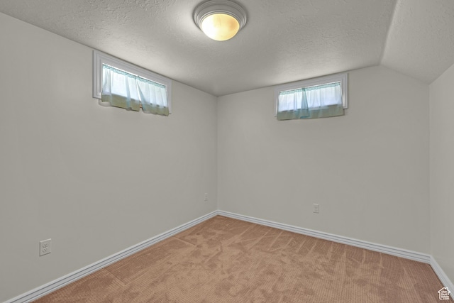 2458 N 575 E, North Ogden, UT 84414 - below grade area featuring a textured ceiling, carpet flooring, and baseboards
