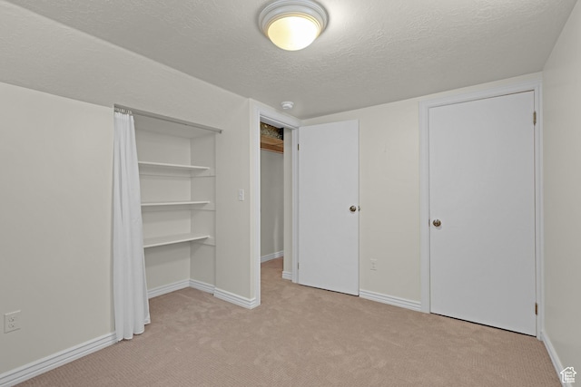 2458 N 575 E, North Ogden, UT 84414 - unfurnished bedroom with carpet flooring, a textured ceiling, baseboards, and a closet