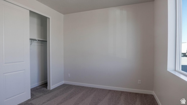 877 W Sika Cir S Unit 203, Saratoga Springs, UT 84045 - unfurnished bedroom with carpet floors, a closet, and baseboards