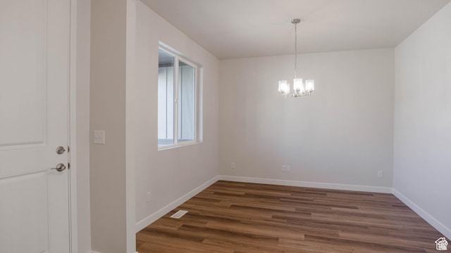 877 W Sika Cir S Unit 203, Saratoga Springs, UT 84045 - unfurnished dining area with a chandelier, dark wood-style floors, and baseboards