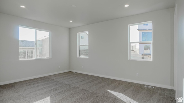877 W Sika Cir S Unit 203, Saratoga Springs, UT 84045 - carpeted spare room featuring healthy amount of natural light, baseboards, and recessed lighting